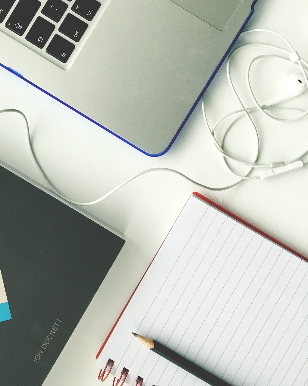 Copywriting with a notebook and laptop