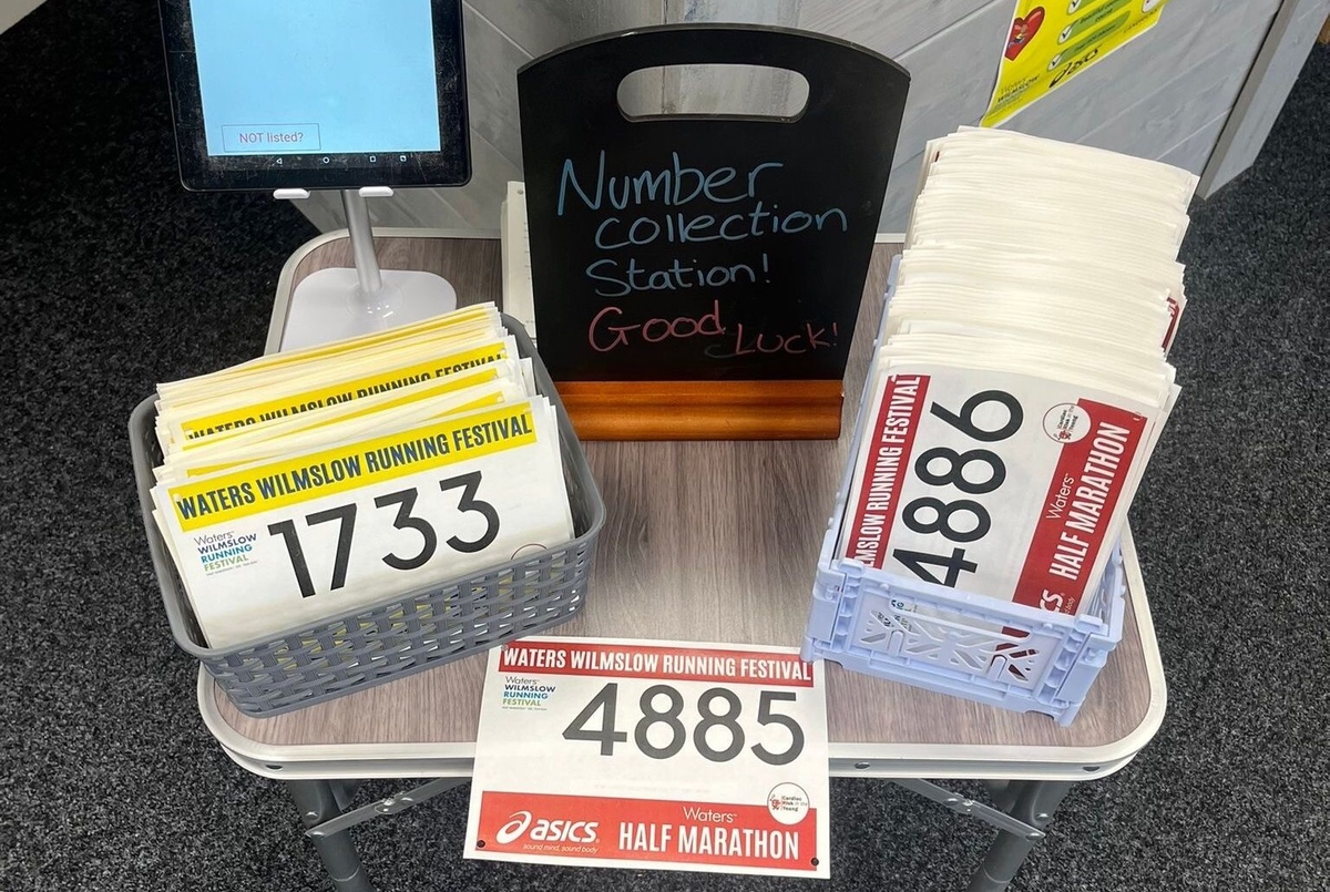 Photo with paper runner numbers awaiting collection by race participants