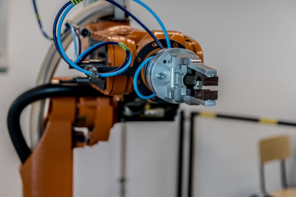 Photo of a robotic arm in an industrial setting